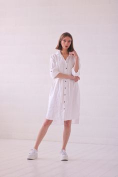 White linen shirt dress with belt. Perfect for women who likes a sporty, non-binding style. For those who want to emphasize the waist, the belt can be tied. You can wear this dress also as a light jacket or a long shirt with shorts or long pants. The length of sleeves are adjustable, so you can wear it in colder or warmer days.  The length of the front of the dress from the shoulder is 100 cm, and the back is 108 cm. Model's height 176 cm., wearing size S. All spring and summer Linen Sheep cloth White Belted Shirt Dress For Summer, Belted Linen Dress For Daywear, Knee-length Linen Shirt Dress, Linen Dress With Tie Waist, Summer Linen Belted Shirt Dress, Daywear Linen Dress With Tie Waist, White Linen Shirt Dress For Daywear, Linen Dress With Tie Waist For Daywear, Summer Linen Shirt Dress With Tie Waist