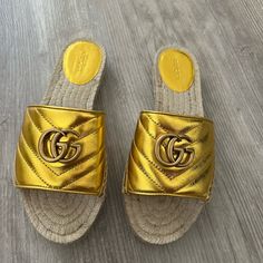 New With Dustbags And Box Designer Gold Sandals For The Beach, Gucci Gold Leather Sandals, Gucci Gold Open Toe Sandals, Gucci Gold Designer Sandals, Gucci Luxury Beach Sandals, Designer Gucci Gold Sandals, Luxury Gucci Sandals For Vacation, Gucci Gold Round Toe Sandals, Gucci Gold Sandals With Round Toe