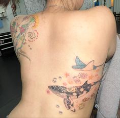 a woman with a tattoo on her back