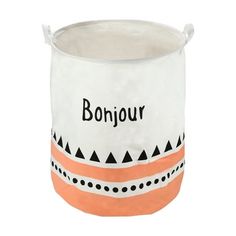 an orange and white pot with the word bonjou on it's side, sitting in