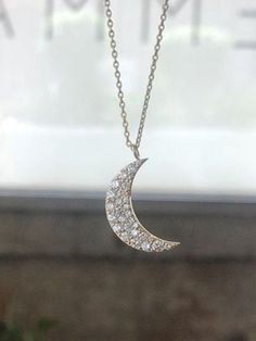 ✨ Gold Half Moon Necklace • 8k Diamond Pendant • Anniversary gift • GEMMA Handmade item Made to Order. Pendant height: 18 Millimetres; Pendant width: 12.15 Millimetres. Materials: Gold, Rose gold, White gold Gemstone: Diamond | SHOP IT IN THE LINK | #pendants #necklaces #inspiration #elegant #sunkissed #neck #aesthetic #photography #woman #jewelry #jewellery Diamond Half Moon Charm Jewelry, Silver Half Moon Diamond Jewelry, Necklaces Inspiration, Neck Aesthetic, Half Moon Diamond, Half Moon Necklace, Gold Crescent Moon, Woman Jewelry, Luxury Jewelry Brands