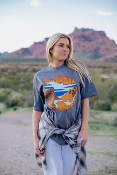 One of our most favorite designs is back and better. Meet the Rocky Mountain Tee-your new favorite graphic tee. Crafted in the USA, this tee is the perfect addition to your outdoorsy wardrobe. Whether you're summiting peaks or busting a move with the local wildlife, our tee ensures you're effortlessly rocking the Rockies in style! 🏞️🎉 Graphic Tee For Hiking With Relaxed Fit, Relaxed Fit Graphic Tee For Hiking, Graphic Tee With Relaxed Fit For Outdoor Activities, Relaxed Fit Graphic Tee For Outdoor Activities, Casual Graphic Print Tops For Outdoor Activities, Relaxed Fit Graphic Print Top For Adventure, Casual Tops With Front Print For Outdoor Activities, Outdoor Relaxed Fit Top With Front Print, Tri-blend Graphic Tee T-shirt For Outdoor