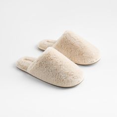 Our cloud-soft slippers cushion feet in the plush comfort and luxurious look of faux fur. The slip-on design makes it easy to slide into, and rubber soles give you a secure footing. Go for total luxury by pairing these beige slippers with our matching faux fur robe. Slippers are also available in small and large sizes.     Faux fur and lining are made of 100% recycled polyester from independently verified sources to help reduce our impact on the environment  Foam fill  Thermoplastic rubber sole  Medium corresponds to women's 8–9 and men's 7–8 shoe sizes-Hand wash; do not bleach or dry clean  Imported Medium Faux Fur Calm Beige Slippers Beige Slippers, Grey Bath Towels, Gray Shower Curtains, White Bath Towels, Blue Shower Curtains, Cool Glasses, Soft Slippers, Old Fashioned Glass, Cotton Bath Towels