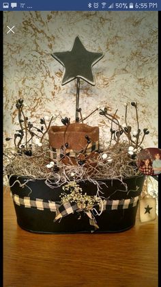 a basket filled with lots of different things on top of a wooden table next to a star