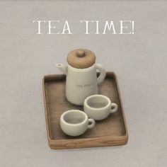 there is a tray with two cups and a tea pot on it that says tea time