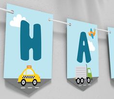 three children's wall hangings with cars and trucks on them, one has the letter h