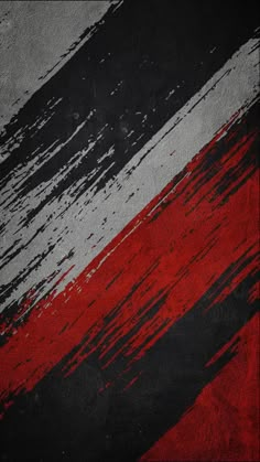 a red, white and black background with brush strokes on it's edges is shown