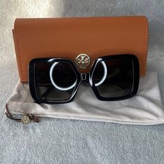 Black Tory Burch Sunglasses Luxury Black Sunglasses For Travel, Luxury Black Glass Sunglasses, Black Tinted Sunglasses For Travel, Elegant Square Frame Sunglasses For Travel, Tory Burch Sunglasses, Accessories Brand, Accessories Branding, Colored Sunglasses, Tory Burch