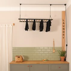 the coat rack is hanging over the kitchen counter