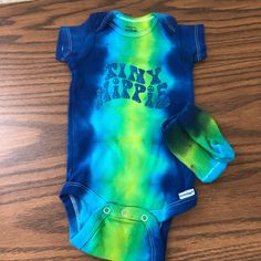 Nwt Gerber Tie-Dye Onesie And Sock Set Size 3-9 Months With “Tiny Hippie” Custom Vinyl Item #Phk3488 Tie Dye Folds, Sock Set, 9th Month, Custom Vinyl, Onesies, Kids Shop, Blue Green, Tie Dye, Color Blue