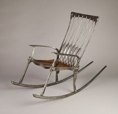 a rocking chair made out of metal and wood