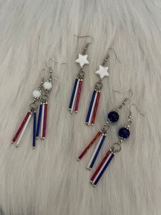 Hi Everyone,  Just love making patriotic earrings for you,     ❤️🤍💙 Handmade Earrings, Red, White, Blue Bugle  Beads, White, Star Charm, Blue, White Beads, Silver Petite Beads, Dangle Earrings. Handmade jewelry custom made earrings and definitely a cool patriotic fashion statement. Handmade earrings can be personalized to fit your style, and making them yourself adds a special touch. Enjoy crafting your red, white, and blue earrings! Handmade Earrings are the great jewelry gifts,  These pair is about 3 inches long from top to bottom. 3 pairs, please pick a color that you would like, White star or White bead, or Blue bead $7.00 each.  Thank you for looking at my handmade jewelry pretty earrings shop. Dyi Earrings, Washer Jewelry, Patriotic Earrings, Patriotic Jewelry, Bead Diy, Patriotic Fashion, Henderson Nv, Earring Ideas, Handmade Fashion Jewelry