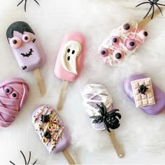 there are many halloween treats on the stick