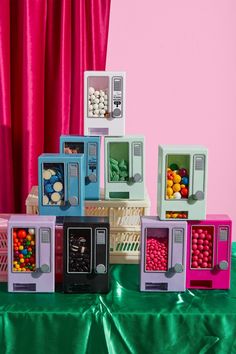 there are many small toy vending machines on the table