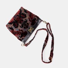 Step into a world of elegance with the Carpet Crossbody Bag - a stunning fusion of rich burnout velvet and genuine leather, meticulously handcrafted to elevate your daily ensemble. Adorned with a charming bronze metal butterfly design swirl lock, this bag exudes both grace and playfulness. The sturdy cotton canvas lining ensures both durability and protection for your belongings. Inside, you'll discover a well-organized structure featuring one full-size slip pocket on one side, alongside three additional slip pockets on the other side. These compartments offer convenient storage for your earphones, keys, or makeup essentials. Versatility is paramount, and that's why each crossbody bag includes a detachable and adjustable shoulder strap, spanning 55” in length. Skillfully fashioned from the Luxury Velvet Shoulder Bag For Formal Occasions, Formal Velvet Rectangular Shoulder Bag, Rectangular Velvet Bag For Everyday Use, Everyday Velvet Rectangular Shoulder Bag, Luxury Tapestry Satchel With Detachable Handle, Formal Embroidered Velvet Bag, Embroidered Velvet Evening Bag, Luxury Velvet Rectangular Shoulder Bag, Luxury Embroidered Velvet Bag