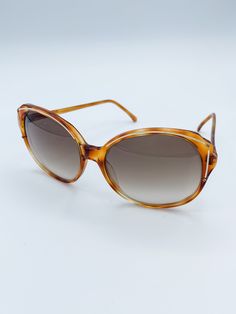 "Details: Vintage Sunglasses Vogart Made in France 70's  Cat Eyed Shaped Tortoiseshell Style Frames Line Accent at Top, Side, and Temple of Frames Screw Accents on Both Sides on Front of Frames Gradient Lenses Lightweight Dimensions: 5.5\" x 2.25\" Inside of Right Temple \"Vogart\" Inside of Left Temple \"005 K97\"" Vintage Brown Cat Eye Sunglasses With Gradient Lenses, Vintage Cat Eye Sunglasses With Gradient Lenses, Vintage Cat Eye Wayfarer Sunglasses With Gradient Lenses, Retro Brown Cat Eye Sunglasses With Gradient Lenses, Vintage Cat Eye Sunglasses With Uva Protection For Summer, Retro Glass Cat Eye Sunglasses For The Beach, Retro Glass Cat Eye Sunglasses For Beach, Vintage Glass Cat Eye Sunglasses For Summer, Vintage Brown Cat Eye Sunglasses For Summer