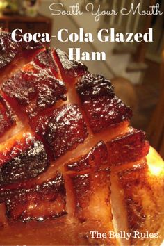 a close up of a piece of food on a plate with the title south your mouth cocoa cola glazed ham