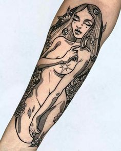 a woman with long hair and flowers on her arm is depicted in this tattoo design