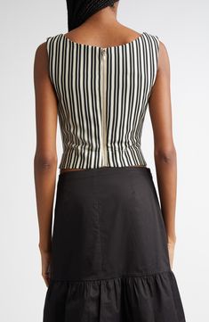 Meet the new-season rendition of Alexia Elkaim's best-selling corset top—this time, refreshed with black-and-white stripes and slender grosgrain ribbons. This coveted style retains the same comfortable stretch-crepe construction as the original, with a supportive mesh lining and structured boning at the back. 18" length (size Medium) Exposed back-zip closure Square neck Sleeveless Lined 97% polyester, 3% spandex Dry clean Imported Designer Clothing Fitted Black Top With Vertical Stripes, Fitted Spring Tops With Contrast Stripes, Chic Fitted Top With Vertical Stripes, Chic Fitted Vertical Stripes Tops, Fitted Tops With Contrast Stripes For Spring, Chic Fitted Tops With Vertical Stripes, Chic Fitted Top With Contrast Stripes, Chic Fitted Tops With Contrast Stripes, Fitted Sleeveless Top With Vertical Stripes