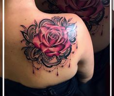 a rose tattoo on the back of a woman's left shoulder and upper arm