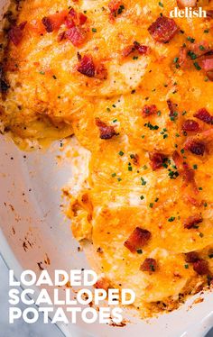 a close up of a casserole in a pan with cheese and bacon on it