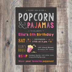 this is a pizza and pajamas birthday party card on a wooden table with wood planks