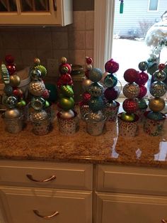 there are many ornaments on the counter in this kitchen