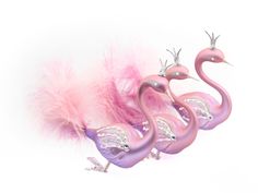 three pink flamingos with feathers on them are sitting in front of a white background