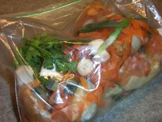 a plastic bag filled with food on top of a counter