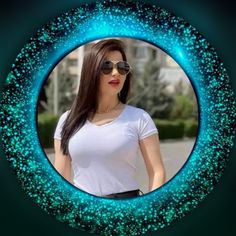 a woman wearing sunglasses is standing in front of a blue circle with stars on it