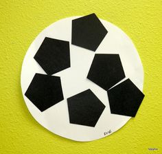 a paper plate with black squares on it