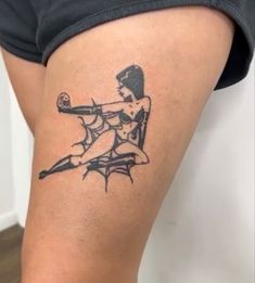 a woman with a tattoo on her thigh holding a baseball bat