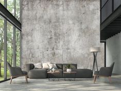 a modern living room with concrete walls and flooring