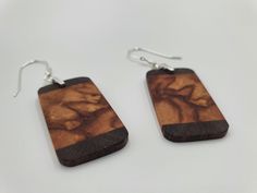 I have for sale these stunning horse chestnut and walnut wooden earrings. These are special book matched earrings making them very unique. They can be worn for both informal and formal occasions and would compliment any outfit. The construction of these earrings is of solid Horse Chestnut wood, walnut top and bottom, with sterling silver bail clasps, high gauge jump rings for strength and durability and oxidised sterling silver spiral bound earring hooks. Measurements: W21 x H38 x D3m Handmade Ring Box, Unique Ring Box, Chestnut Wood, Horse Chestnut, Wooden Bangle, Earrings Making, Chestnut Horse, Wood Bracelet, Engagement Ring Box