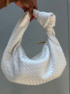 Elevate your look with our chic Woven Shoulder Bag. This medium sized purse is both trendy and practical, ideal for work or travel. Crafted from stylish vegan leather, it's sure to turn heads wherever you go. 💼 A versatile accessory that adds flair to any outfit. With functionality in mind, it comes with a silver zipped closure, ensuring that all your belongings are secure and safe. Inside, the bag is lined with faux leather, which gives it an elegant finish. There's also a zipper interior pock Modern Clutch Bag With Braided Handles, Chic Clutch With Braided Handles For Everyday, Chic Everyday Clutch With Braided Handles, Chic Handheld Baguette Bag For Errands, Chic Pouch Hobo Bag With Single Shoulder Strap, Modern Shoulder Bag With Braided Handles Clutch, White Crossbody Hobo Bag For Evening, Versatile White Handheld Hobo Bag, Chic Tote Clutch For Errands