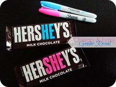 hershey's milk chocolate bars with pink and blue marker pens on black background