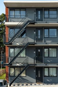 an apartment building with several balconies and stairs