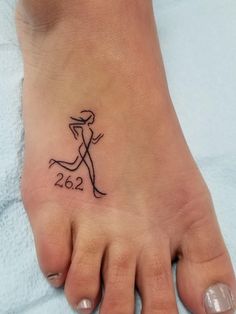 a woman's foot with a tattoo on it that reads 2052 and the number twenty five