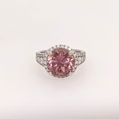 Presenting NNJ Designs' Summer Collection! This beautiful estate ring features a 5.07 carat round pink tourmaline gemstone with natural earth mined diamonds, all set in solid 14K gold. This Pink Tourmaline ring makes a lovely October birthstone gift for your loved ones! This ring is made with solid 14K Gold and natural Earth mined SI / G-H diamonds. As listed, this ring is ready to ship. If you're interested in purchasing this setting with a different center stone please message us! Designer Silver Jewellery, Estate Ring, Estate Rings, Pink Tourmaline Ring, Jewelry Showcases, Birthstone Gifts, Tourmaline Ring, October Birthstone, Tourmaline Gemstone