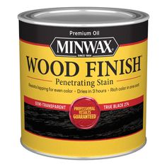 a can of wood finish is shown on a white background with red and yellow accents