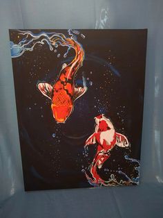 a painting of two koi fish in the water