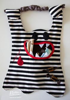 a black and white striped bag with red accents