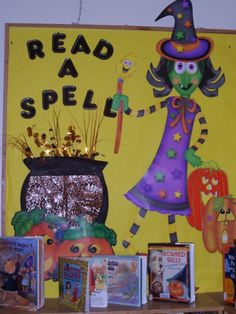 there is a sign that says read a spell on the wall next to bookshelves