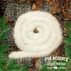 the fur accents usa christmas tree ornament is on display in front of a colorful background