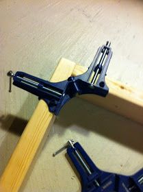 two pieces of wood are being used to make a diy project with pliers