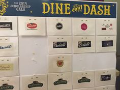 a large poster with many different types of wine labels on it's sides and the words dine and dash written in gold