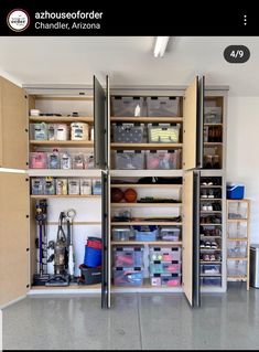 the inside of a garage with shelves and bins