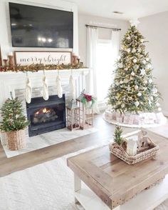 a living room with a christmas tree and fireplace