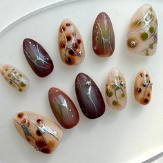 Short almond nails press-on set showcasing mesmerizing ombre nail art designs Nail Brown Color, Earthy Nails Short, Fall Press On Nail Designs, Fig Nails, Brown Color Nails, Brown Nails Art, Brown Nail Set, Nail Set Short, Brown Almond Nails