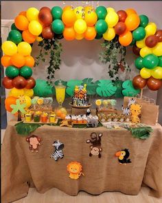 an animal themed birthday party with balloons and decorations